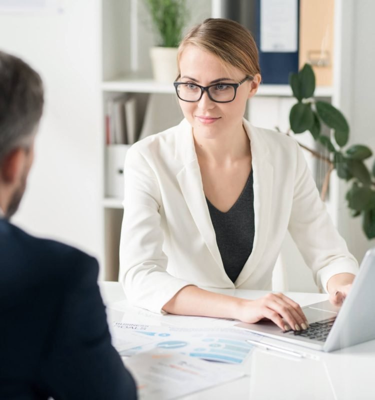 content-attractive-female-business-consultant-working-with-clien-1.jpg